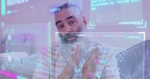 Mature man gesturing at augmented reality global map overlay while presenting from couch