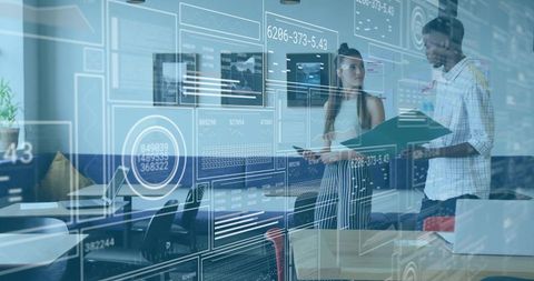 Colleagues Discuss Augmented Reality Data in Innovative Office Environment