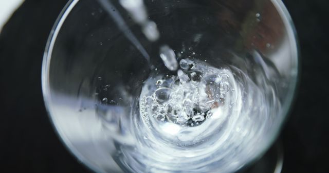 Close-Up of Water Being Poured into Clear Glass - Download Free Stock Images Pikwizard.com