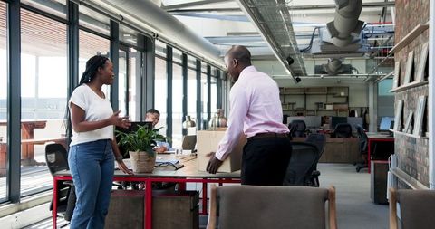New employee introduced to diverse coworkers in modern office
