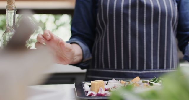 Chef Preparing Fresh Ingredients in Modern Kitchen with Blue Apron - Download Free Stock Images Pikwizard.com