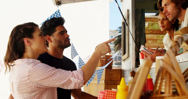 Couple Ordering Food from Truck Vendor at Outdoor Market - Download Free Stock Images Pikwizard.com