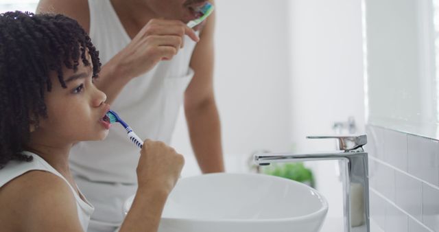 Father and Daughter Brushing Teeth Together in Modern Bathroom - Download Free Stock Images Pikwizard.com