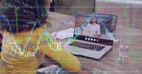Woman watching virtual meeting on laptop with stock market charts overlay for remote work