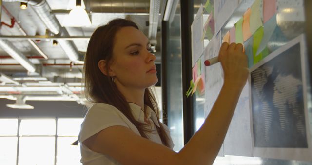 Businesswoman Brainstorming Ideas on Office Whiteboard - Download Free Stock Images Pikwizard.com