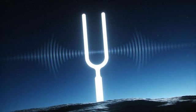 Luminous tuning fork emitting concentric waveform ripples on cratered lunar plain