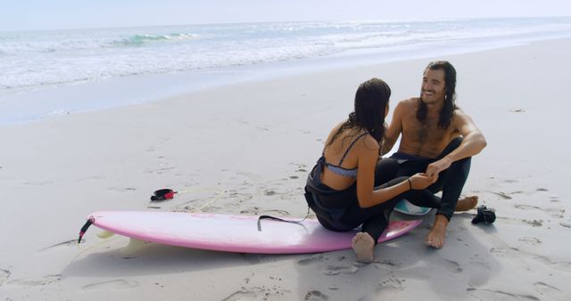 Young Couple Enjoying Beach Moment with Surfboard by the Ocean - Download Free Stock Images Pikwizard.com