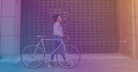 Young Woman Walking Bicycle While Checking Smartphone in Urban Area - Download Free Stock Images Pikwizard.com