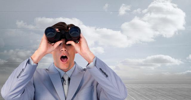Digital composite of Shocked businessman looking through binoculars