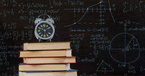 Alarm Clock on Books with Math Equations on Chalkboard - Download Free Stock Images Pikwizard.com