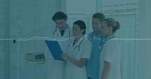 Medical Team Consulting and Reviewing Patient Notes in Hospital Ward