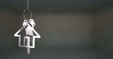 Keychain in Shape of House with Keys Hanging on Chain