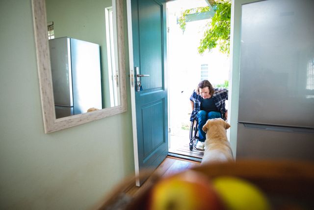 Caucasian disabled man sitting on the wheelchair entering his house through the door. handicap and disability concept