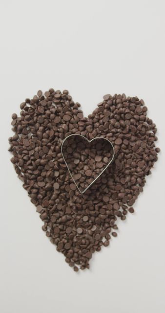 Heart Shape Chocolate Chips with Cookie Cutter on White Background - Download Free Stock Images Pikwizard.com