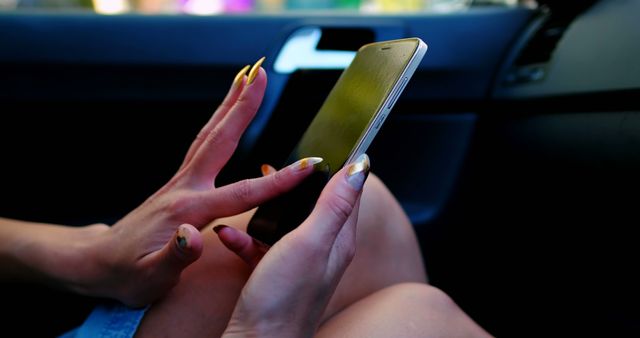 Woman Using Smartphone with Long Yellow Nails in Car - Download Free Stock Images Pikwizard.com