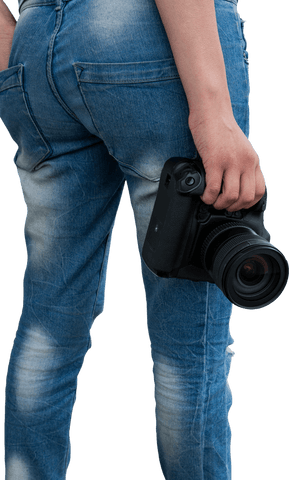 Woman in jeans holding digital camera with transparent background