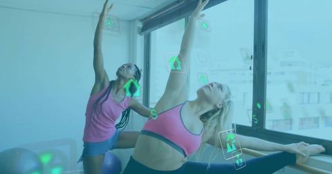Two Women Practicing Yoga with Digital Augmentation