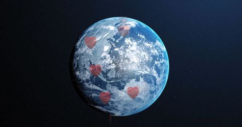 Spinning earth with overlapping hearts highlighting global love