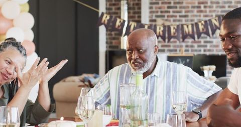 Family Celebrating Retirement Party Together at Home