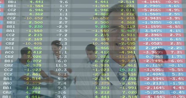 Doctors Analyzing Digital Data in Hospital Corridor