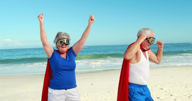 Senior Couple Having Fun as Superheroes on Beach - Download Free Stock Images Pikwizard.com