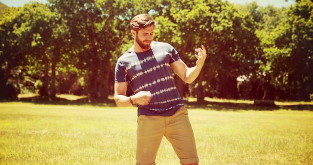 Young Man Pretending to Play Air Guitar at Park on Sunny Day - Download Free Stock Images Pikwizard.com