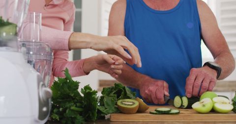 Senior Couple Preparing Nutritious Smoothies Together