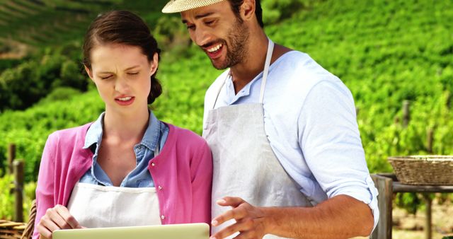 Young Farmers Using Tablet in Vineyard on Sunny Day - Download Free Stock Images Pikwizard.com