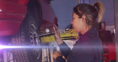 Female Mechanic Working on Car in Auto Repair Shop - Download Free Stock Images Pikwizard.com
