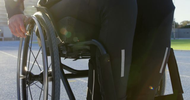 Adaptive sports athlete preparing for track practice in wheelchair - Download Free Stock Images Pikwizard.com