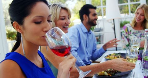 Diverse Group Enjoying Outdoor Dining Experience with Wine and Good Company - Download Free Stock Images Pikwizard.com