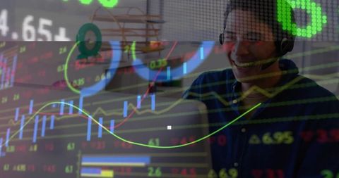 Smiling Asian Man Analyzing Stock Charts with Digital Technology