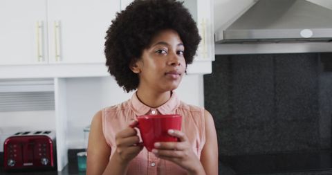Woman Holding Coffee Cup Relaxing at Home Kitchen - Download Free Stock Images Pikwizard.com