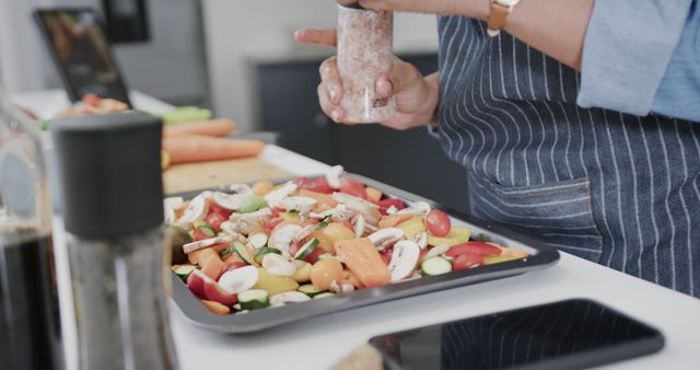 Woman Seasoning Colorful Vegetable Tray in Modern Kitchen - Download Free Stock Images Pikwizard.com