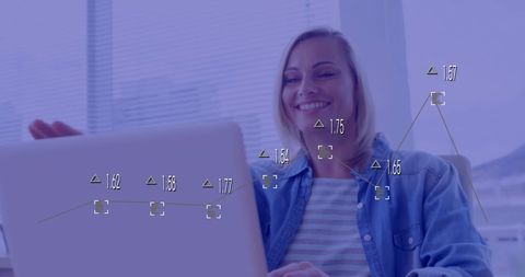 Businesswoman processing financial data on laptop