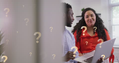 Colleagues Collaborating with Laptops and Animated Question Marks