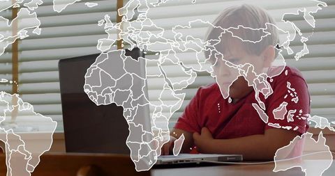 Child typing on laptop wearing red shirt with world map overlay learning online geography