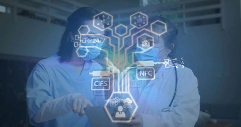 Doctors reviewing secure records on tablet using nfc cifs hud for telemedicine collaboration