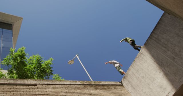 Urban Freedoms: Parkour Practitioners Jumping Across Buildings - Download Free Stock Images Pikwizard.com