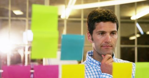 Man Brainstorming Ideas with Office Sticky Notes - Download Free Stock Images Pikwizard.com