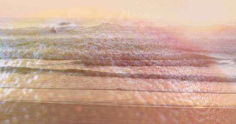 Gentle Ocean Waves Reflecting Pastel Sky at Sunset