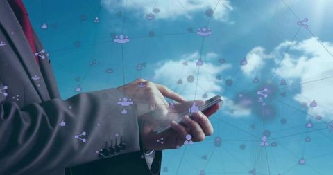 Executive tapping smartphone with network icons overlay over blue sky business connectivity