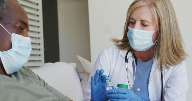 Healthcare Professional Discussing Prescription with Patient During Home Visit - Download Free Stock Images Pikwizard.com