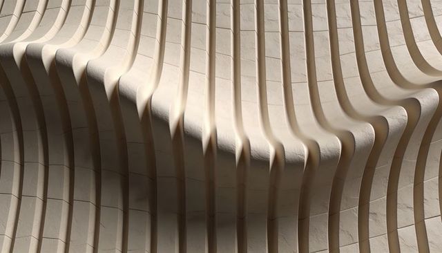 Ribbed Curving Stone Wall with Vertical Fins and Deep Shadows, Modern Sculptural Paneling
