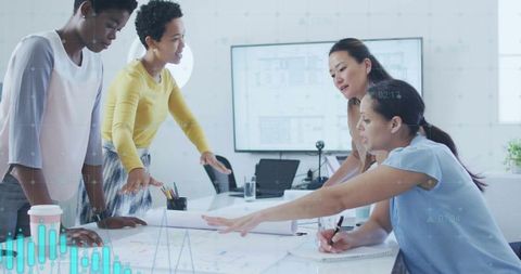 Diverse Women Collaboration on Architectural Designs in Modern Office