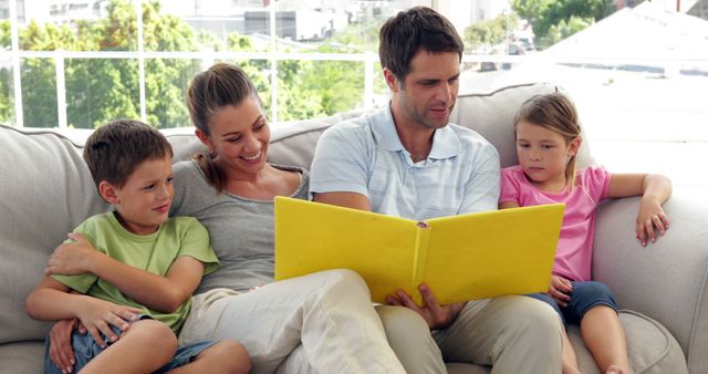 Parents Reading With Children on Couch at Home - Download Free Stock Images Pikwizard.com