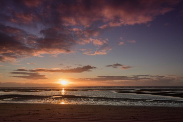 Serene Sunset Over Calm Ocean Shore - Download Free Stock Photos Pikwizard.com