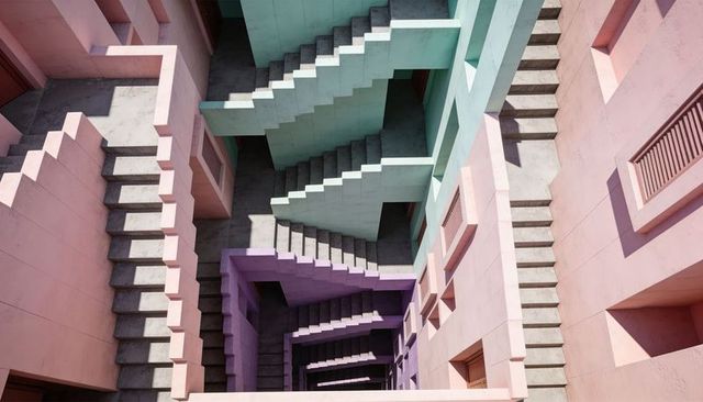 Showcasing Stacked Pastel Staircase Atrium with Geometric Concrete Layers and Dramatic Light