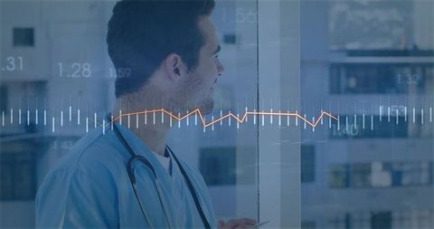 Male Clinician in Blue Scrubs Looking Out Hospital Window with Digital Health Data Overlay