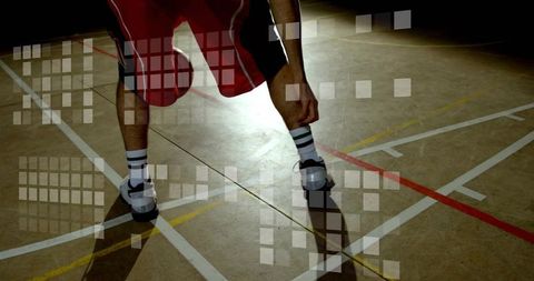 Athlete adjusting shoe on indoor court with dramatic backlight, shadow and grid overlay
